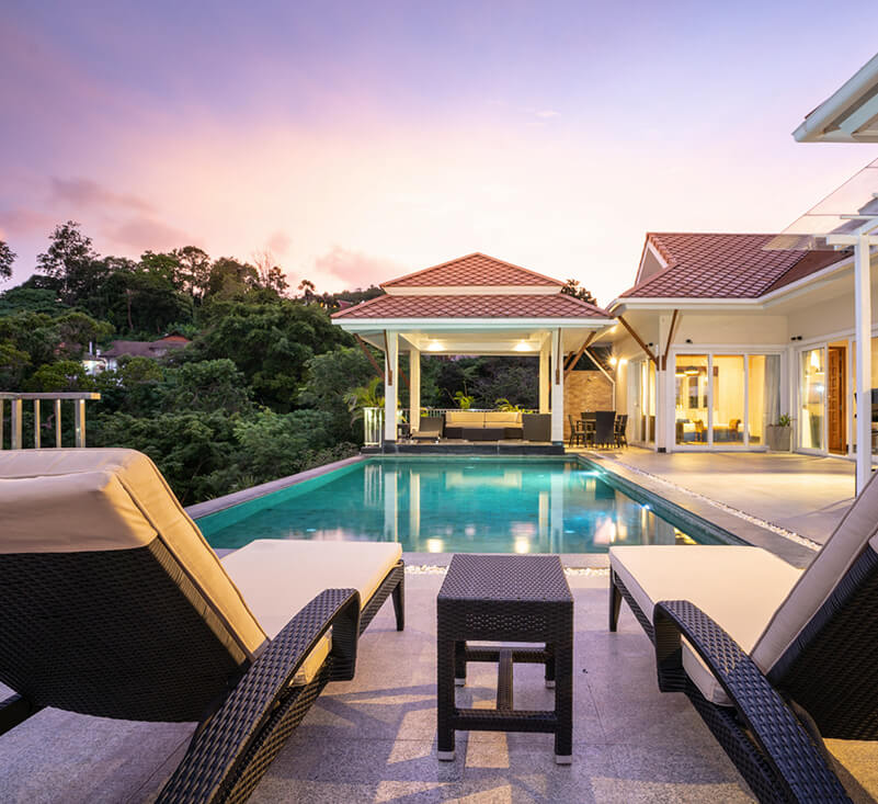 rectangular pool with lightning features next to a attached ADU