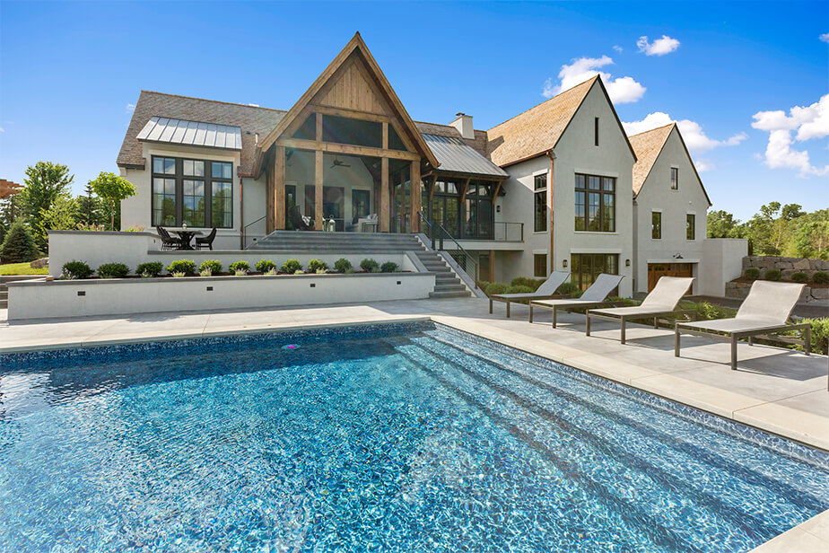 huge pool perfectly designed according to the house backyard