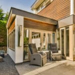 Room added to the side of the main residence. Large glass doors leading to patio with recliners.